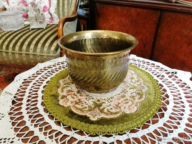 Old brass pot with a special shape and a smaller size