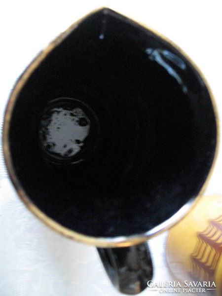 Retro decorative black and gold ceramic jug with vase