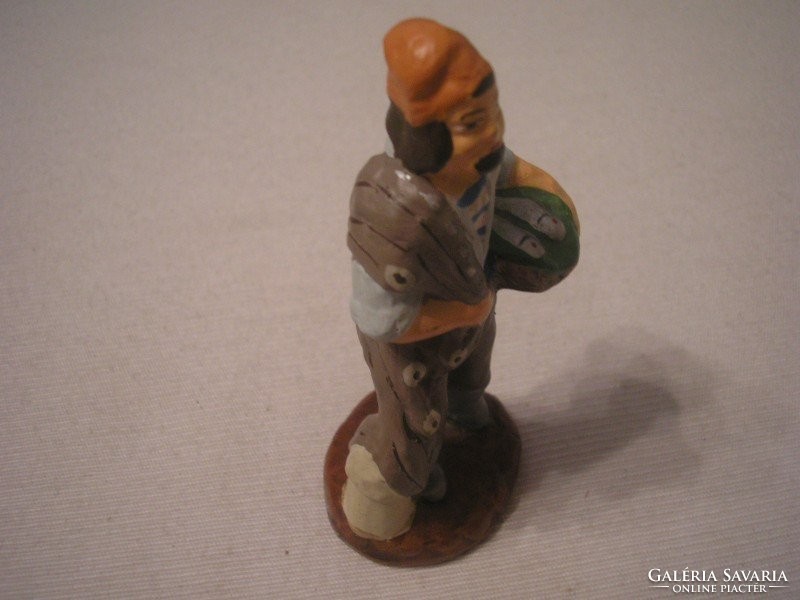 U6 the fishmonger marked terracotta glazed Spanish sculpture in fishing competitions placed in bright colors