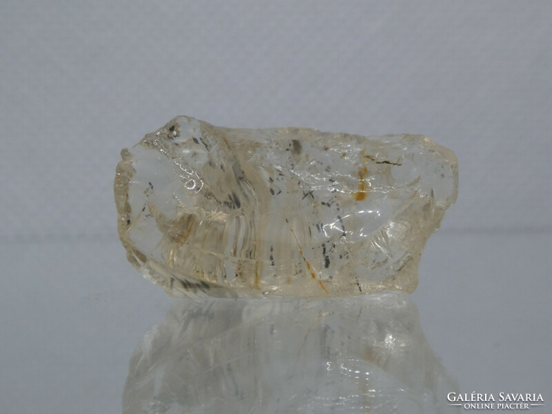 A piece of natural, raw golden marialite (a version of the scapoly) mineral. 7 grams of jewelry base material.