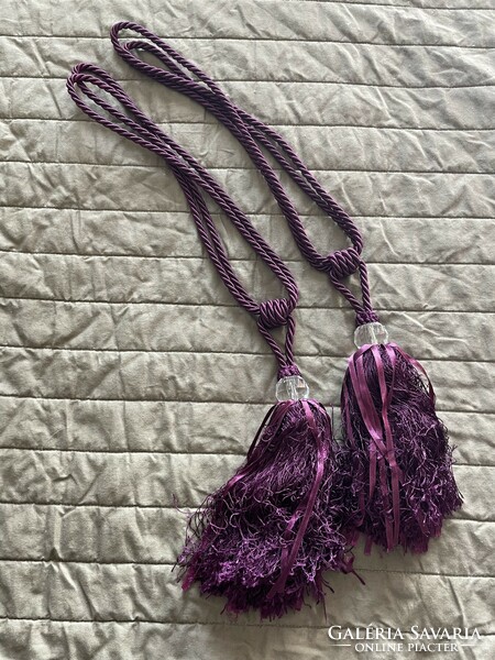 Purple curtain binding tassels in pairs