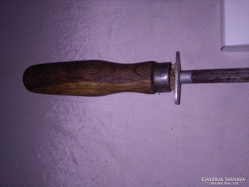 Old knife sharpener with a wooden handle