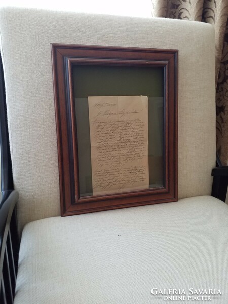Court documents in open glass frame