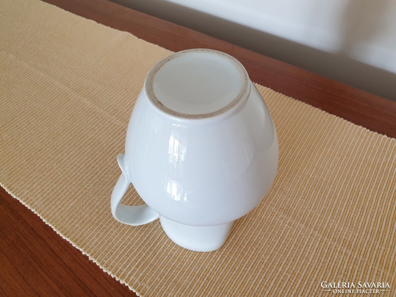 Old porcelain white jug folk vintage wine jug