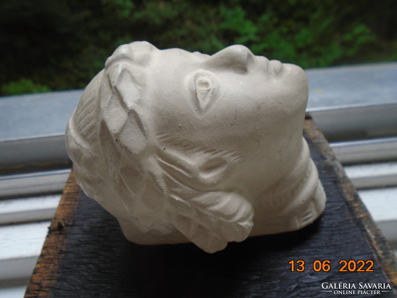 Female plaster head in ancient style with laurel wreath