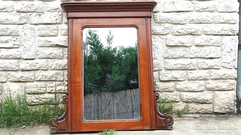 Antique wooden mirror from the 1800s, with a carved, faceted mirror. Neo-Baroque, Viennese Baroque