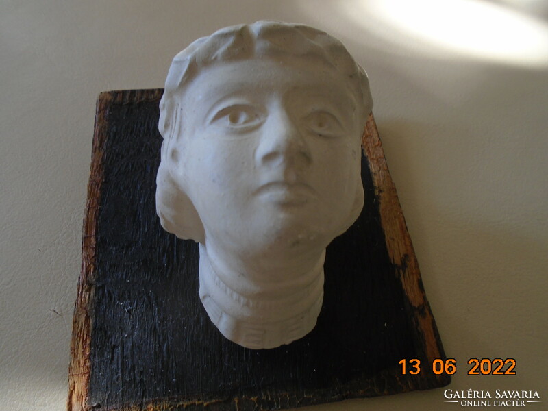 Female plaster head in ancient style with laurel wreath