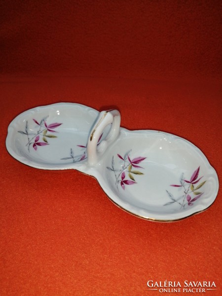 Old double-sided porcelain holder with table salt and pepper.