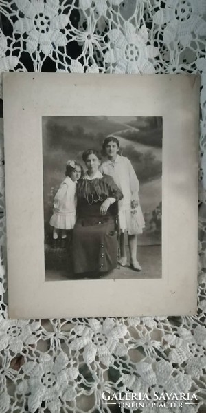 Antique photo of ladies from 1916 kiss Joseph Joseph in his own house