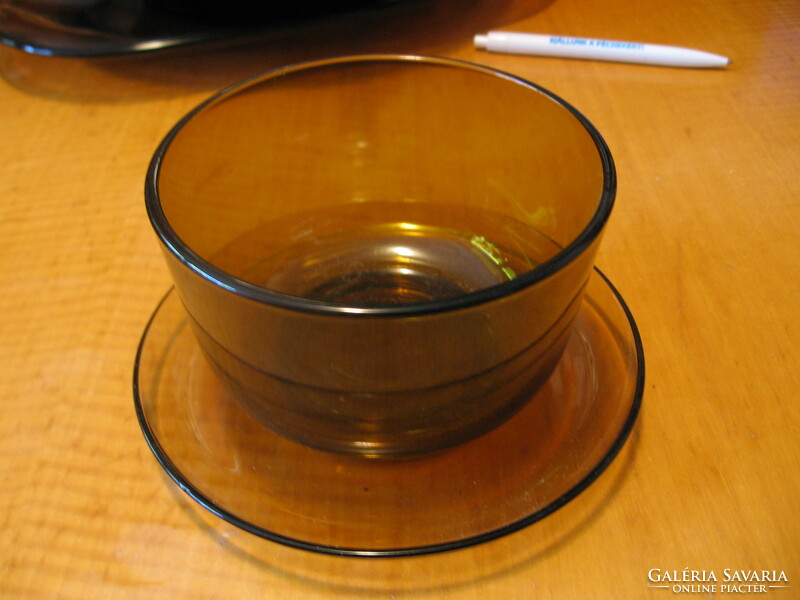 Smoke-colored glass bowl with sauce, soup and muesli