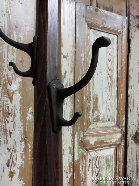 Wooden coat hanger, coat stand with cast iron hangers from the 1930s