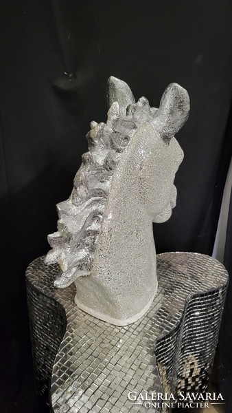 Design horse head covered with mirror mosaics