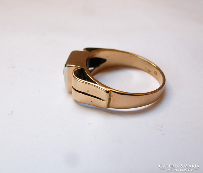 Gold ring with diamonds.