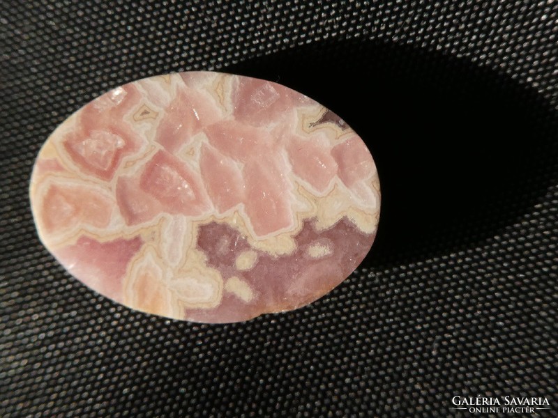 A piece of rhodochrosite, naturally polished. Jewelry base material. 4.75 Grams