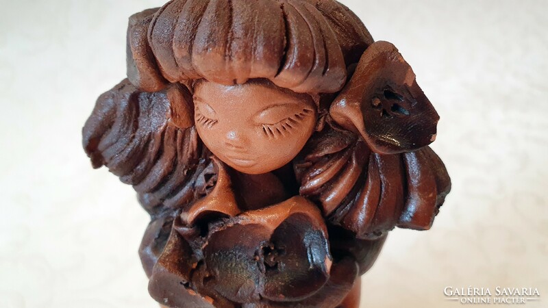 The work of György Újpál. Beautiful, old, brown-glazed, ceramic little girl with flowers. 17.5 cm. Significance.