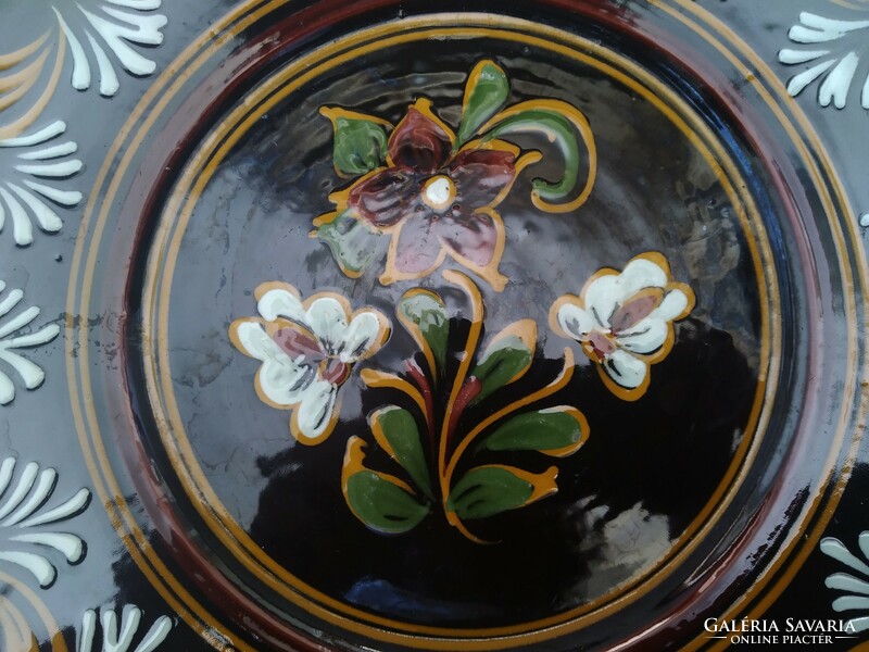Large, painted ceramic wall ornament