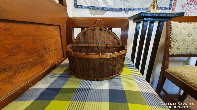 Old table or wall basket, flower stand. It is made by hand from wood shavings and bark
