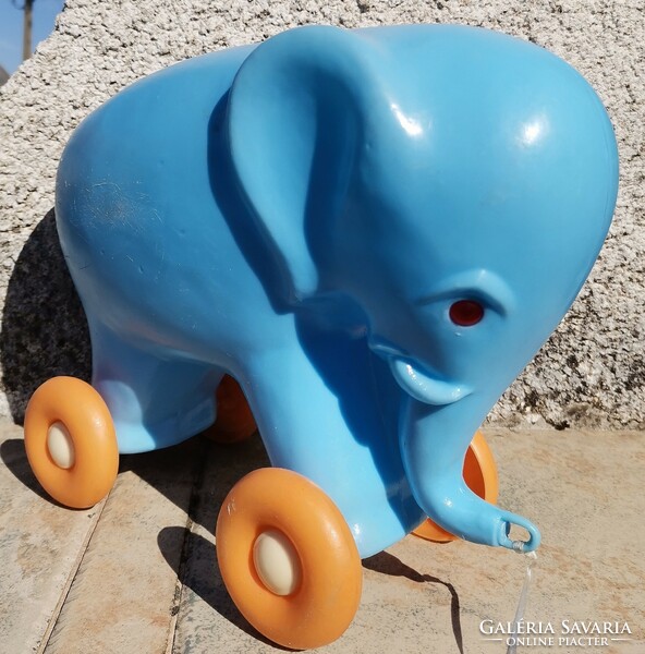 Retro rolling pullable blue plastic elephant