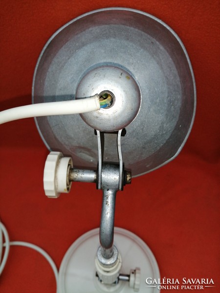 Old table lamp, infrared lamp, or workshop lamp.