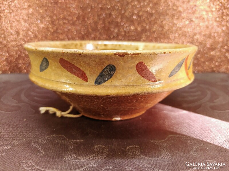 Decorative ceramic bowl with burnt glaze