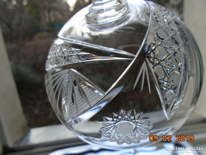 A crystal glass with a base with rich detailing