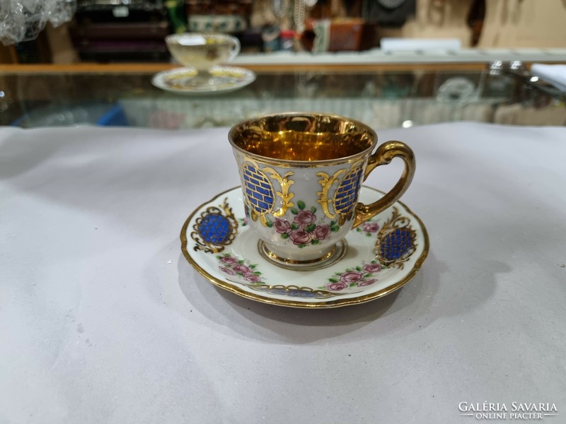 Old gilded coffee cup