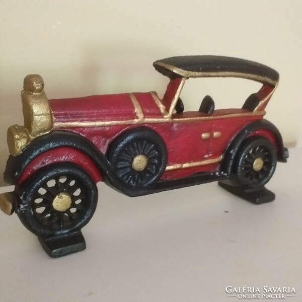 Old cast iron car ornament