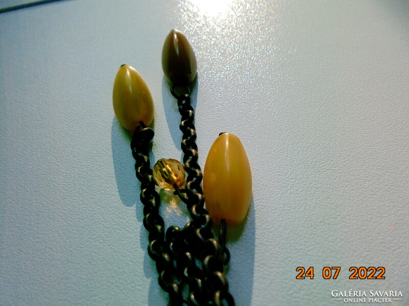 Grandiose, artistic bronze, twisted non-figurative pendant, bronze chain with 11 amber pendants