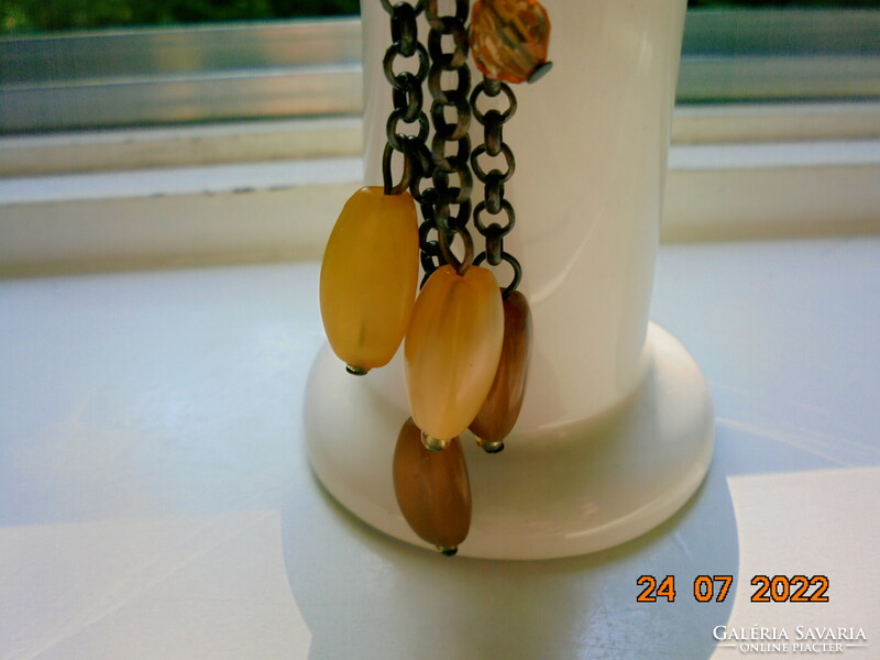 Grandiose, artistic bronze, twisted non-figurative pendant, bronze chain with 11 amber pendants