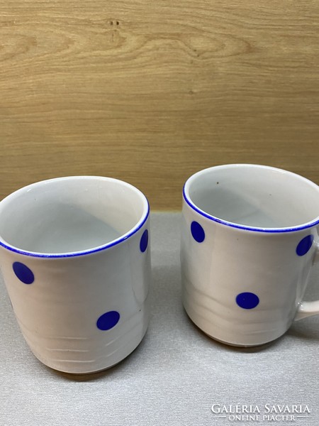 A pair of speckled mugs.