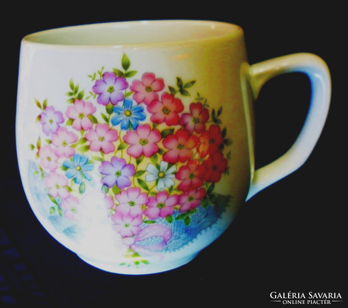 A charming floral mug with a pot belly. 240.