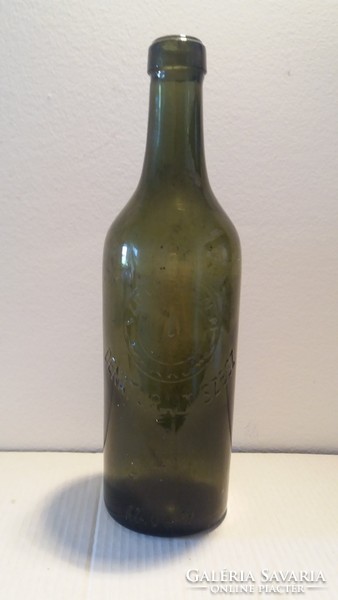 Old bottle denatured spirit labeled green glass