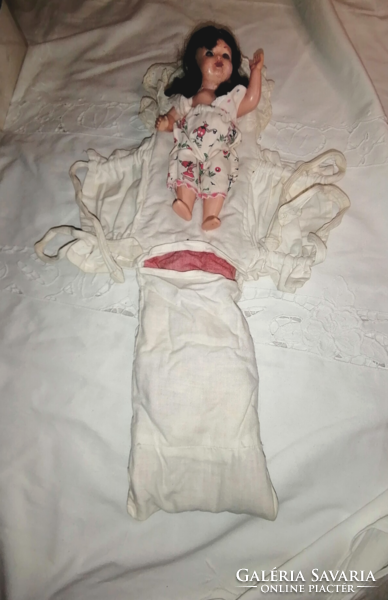 Sleeping baby in swaddling clothes, from the sixties
