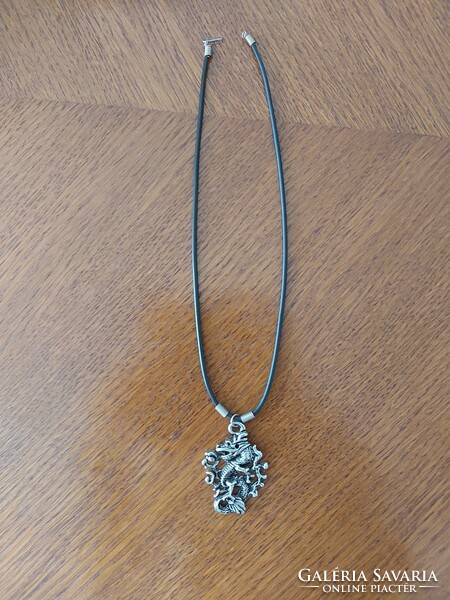 Rubber necklace with dragon pendant