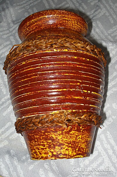 Old, glazed wicker decorative vase