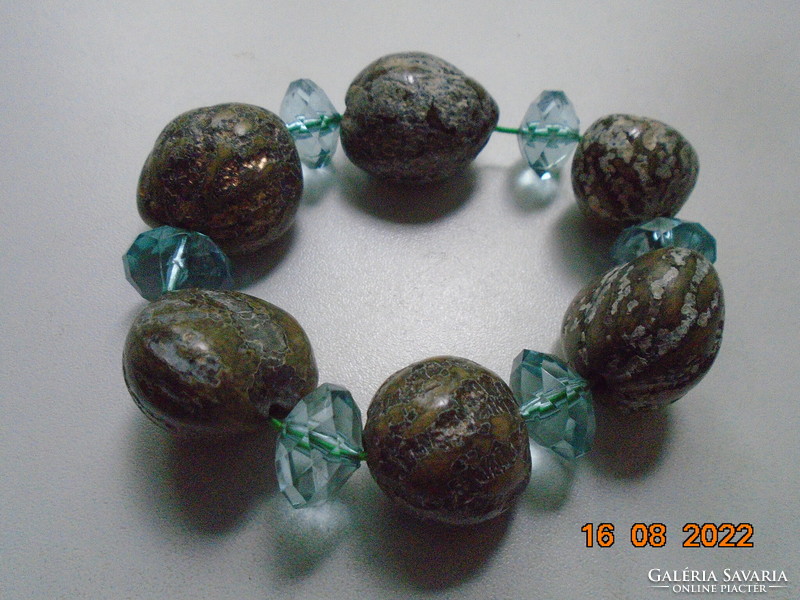 Ocean jasper bracelet made of irregular marbled, golden crystalline gray spheres