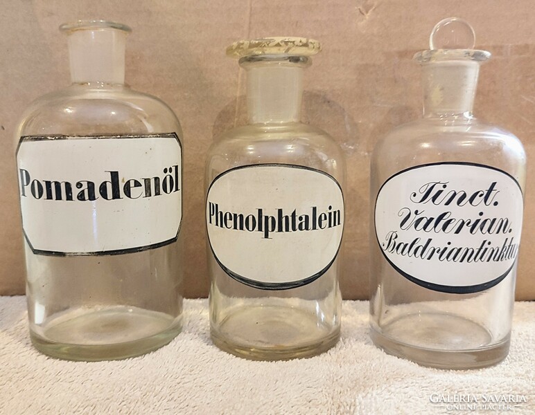3 antique German pharmacy bottles with painted labels.