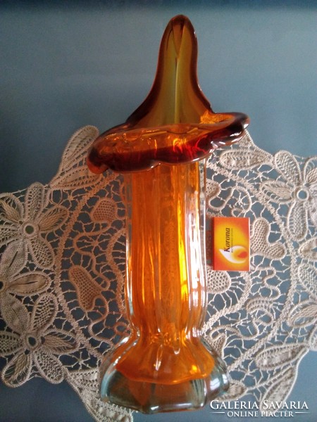 Amber-colored glass vase with a special, curved wavy rim design!