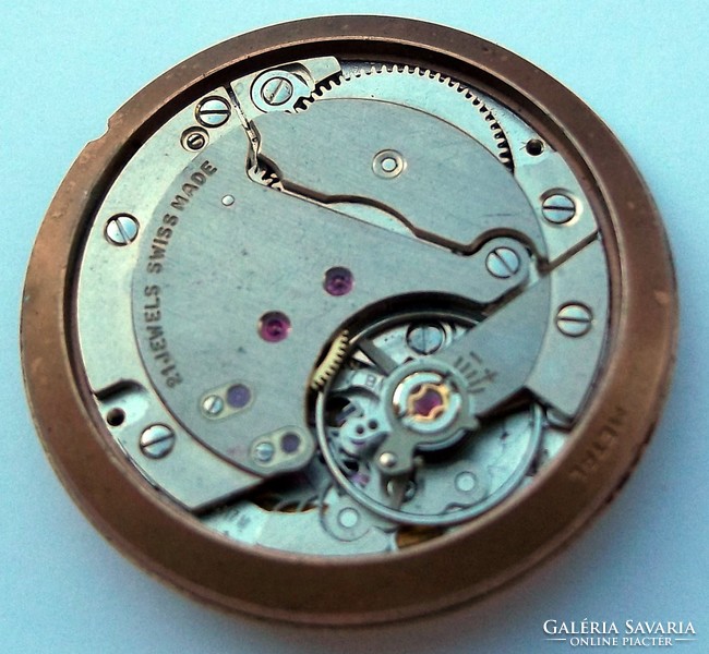A remnant of a gold watch