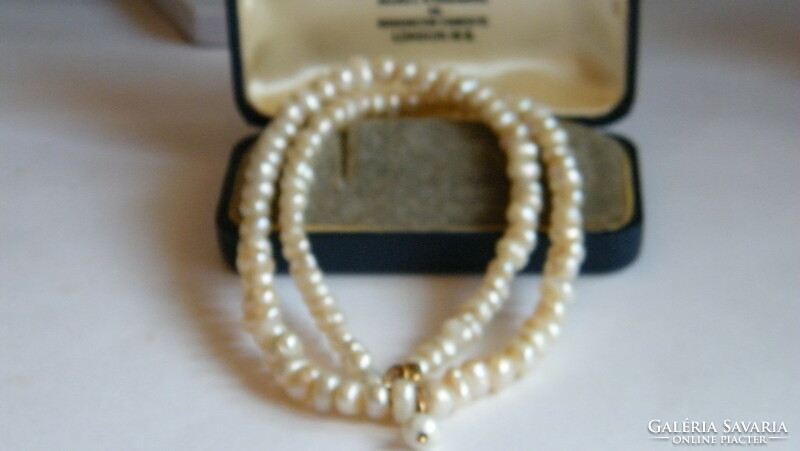 Old freshwater cultured pearl necklace with 14 arm clasps and pendant.
