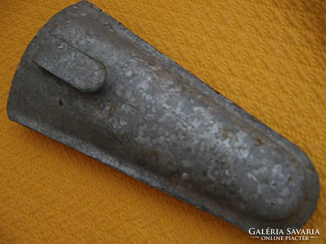 Old galvanized scythe holder