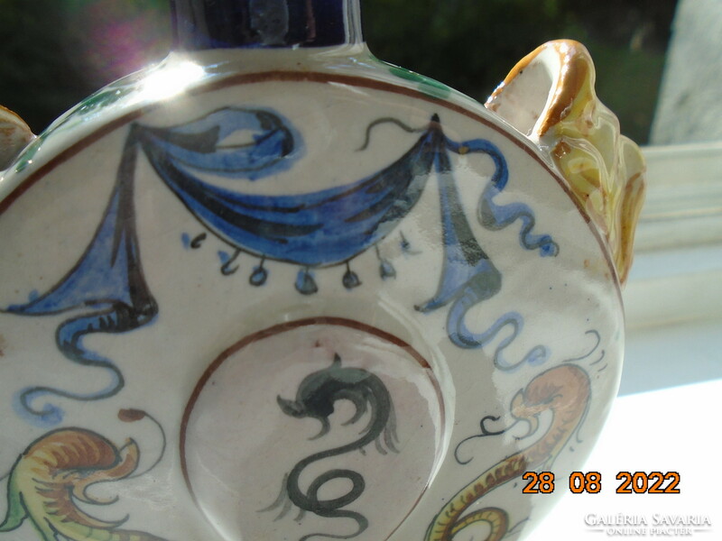 Antique renaissance majolica vase with faun heads, sea monsters and Florentine lilies