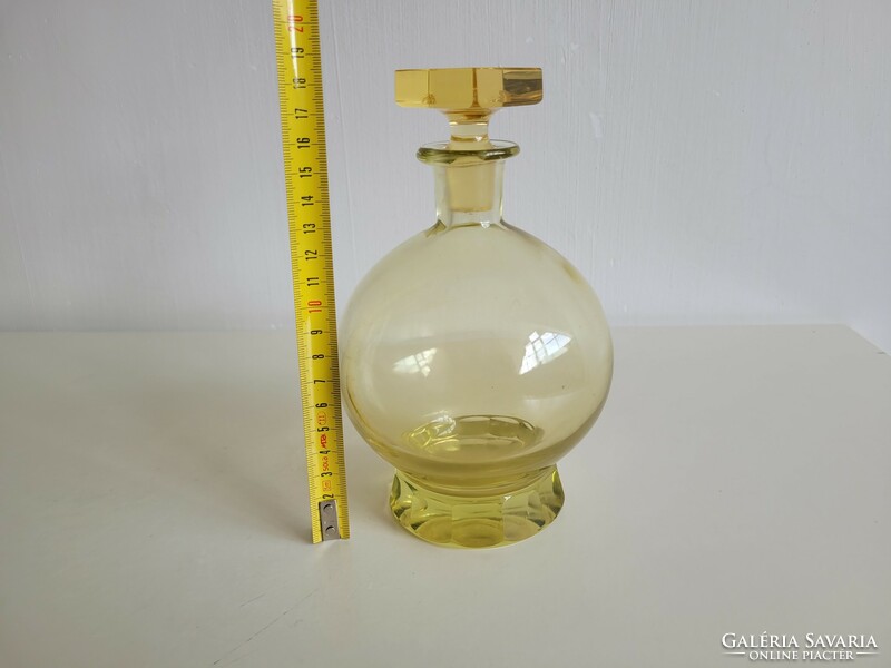 Old liqueur glass yellow short drink spherical corked bottle