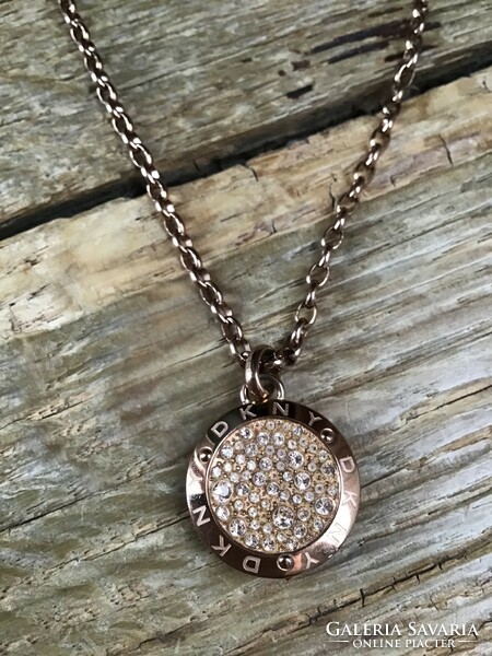 Original dkny rosé gold necklace with pendant decorated with gilded zirconia stones