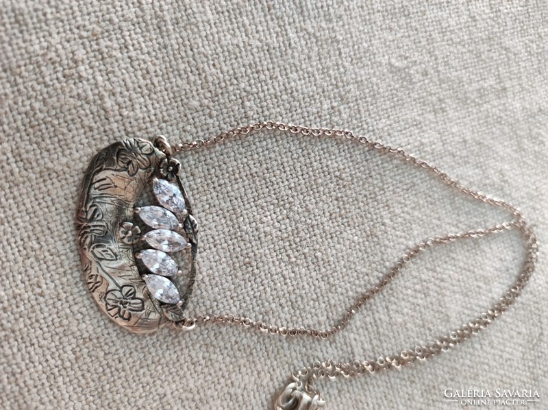 Silver necklace with a beautiful pendant and zircon stones