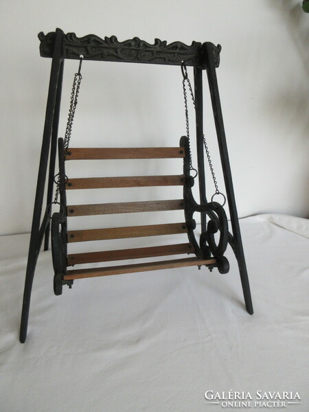 Old, decorative wrought iron and wooden baby swing. Negotiable!