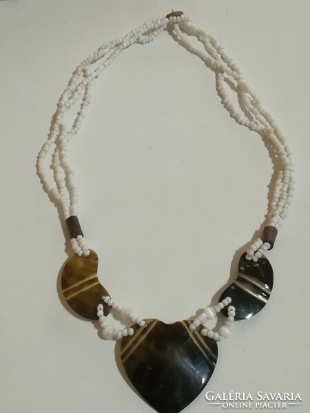 Handmade necklace with black shell pendant.