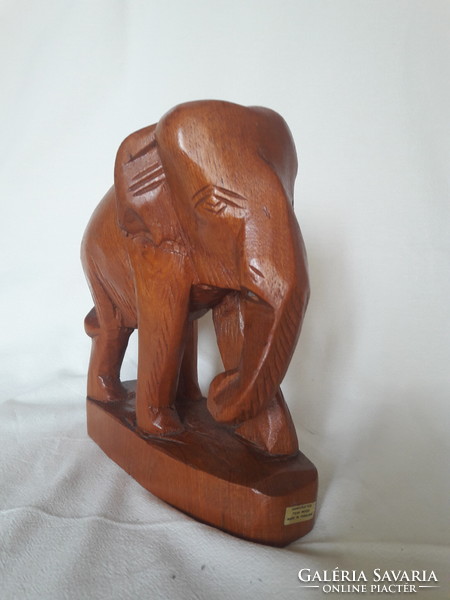 Hand-carved teak elephant statue from Thailand, also suitable as a bookend