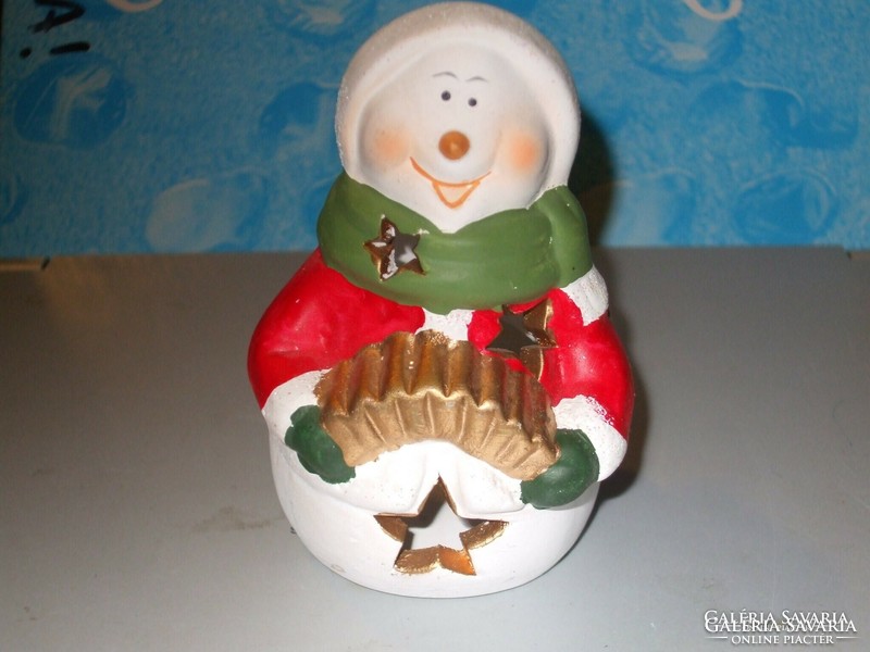 A snowman dressed as Santa Claus