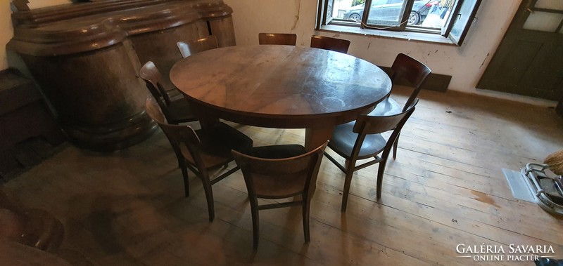 Extendable antique dining table with 8 chairs